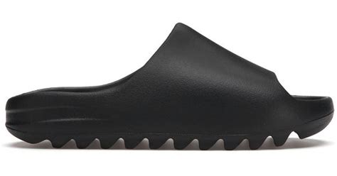 yeezy slides black men.